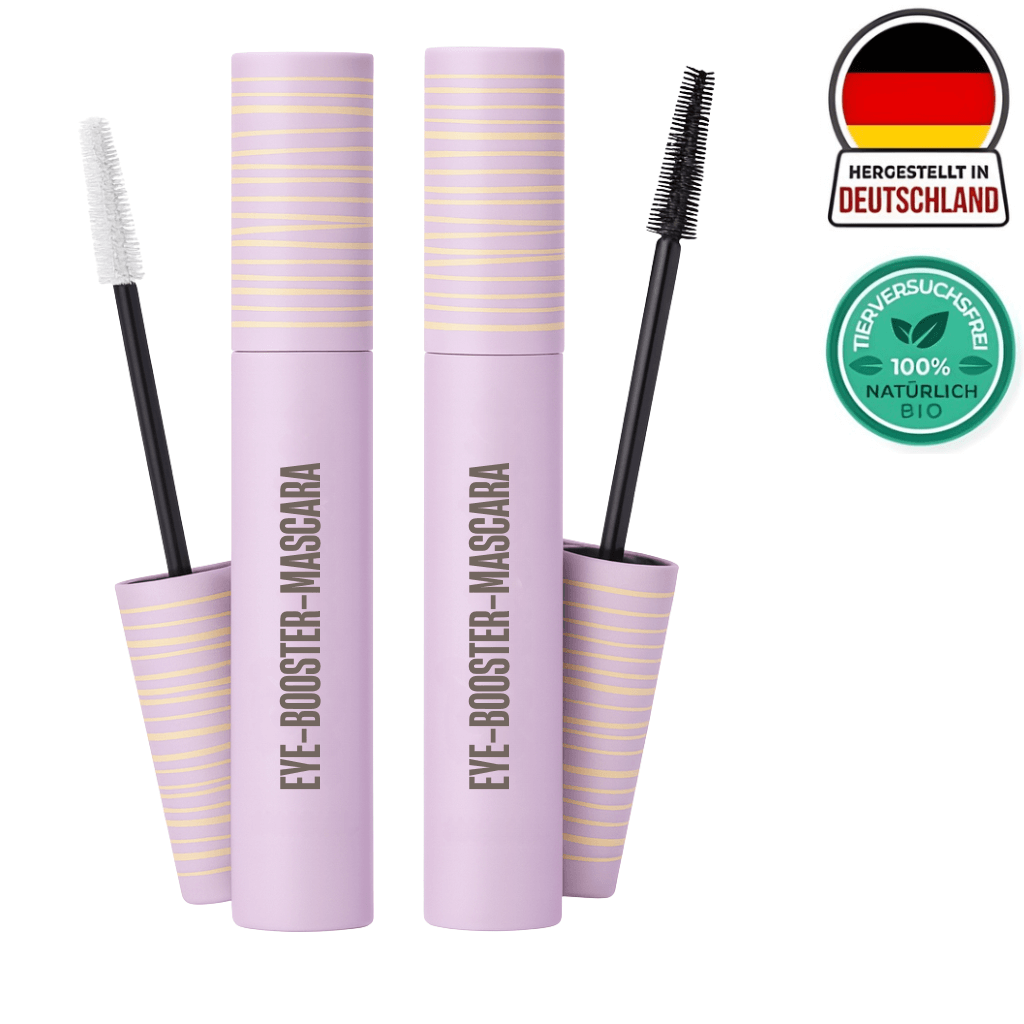 Eye-Booster-Mascara in lila Verpackung mit Bürsten für definierte, längere Wimpern und natürliches Finish.